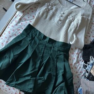 Green pleated skirt